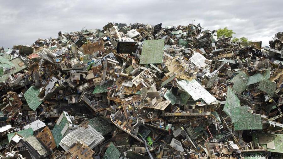 Photograph of a large pile of discarded electronic equipment