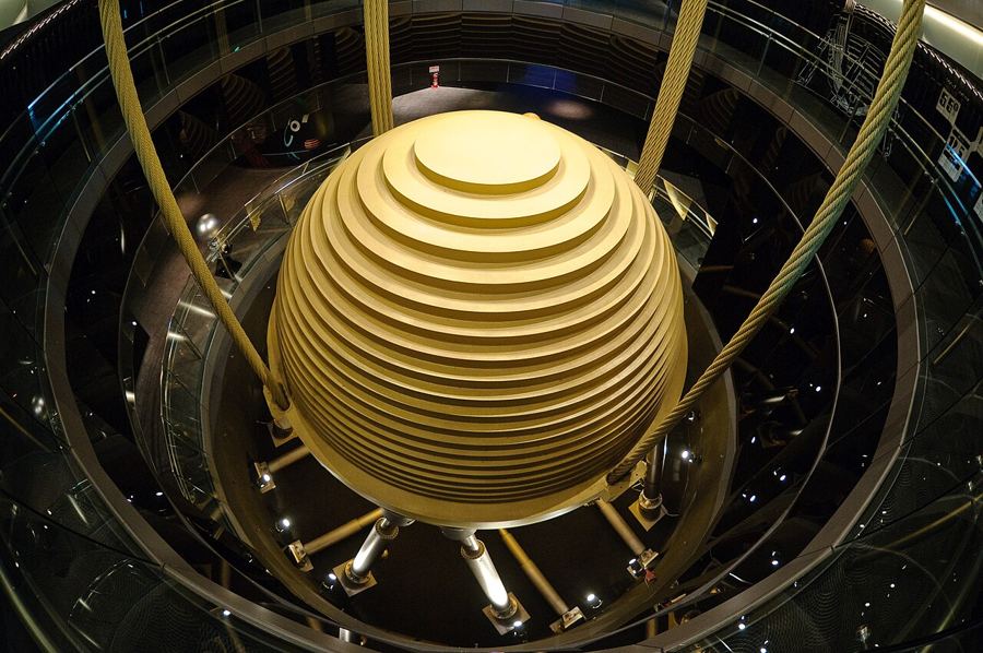 The huge golden steel sphere of the Taipei 101 tuned mass damper, hanging on cables